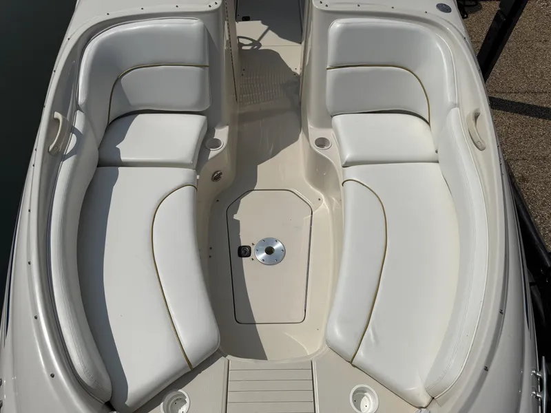 Slide: The Image of The image shows the cockpit of a 2000 Sea Ray 240 Sundeck with white upholstery. - 8