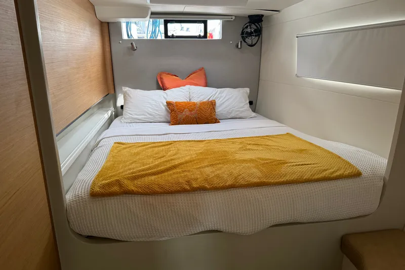 Slide: The Image of Cozy bedroom in 2024 Vision 444ES yacht with modern decor and vibrant bedding. - 23