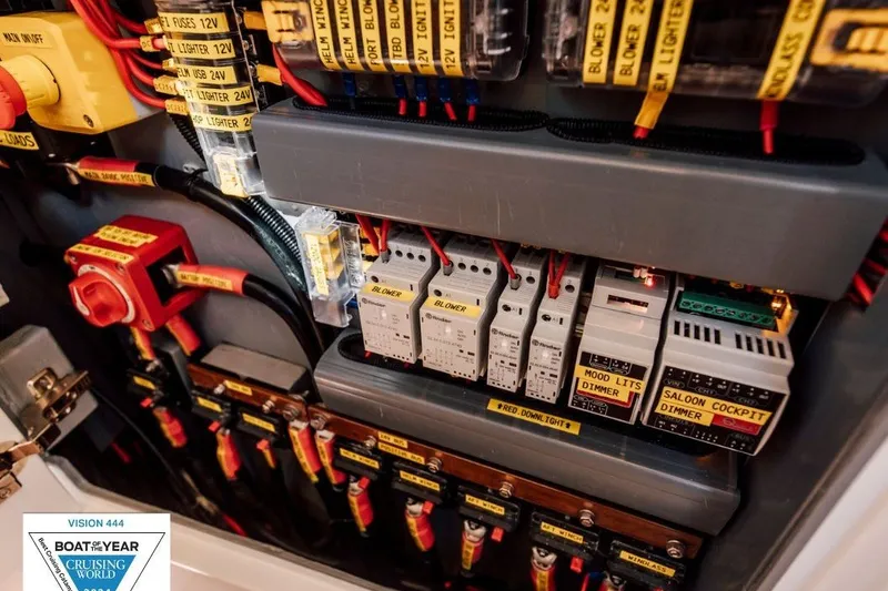 Slide: The Image of Electrical panel of Vision 444ES 2024 boat, featuring labeled switches and wiring. - 33