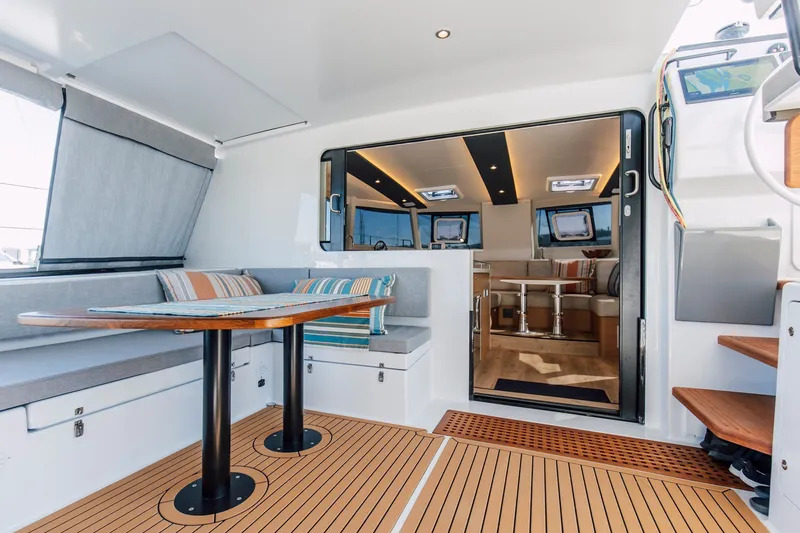 Slide: The Image of Luxurious interior of 2024 Vision 444ES yacht with modern seating and elegant wood flooring. - 14