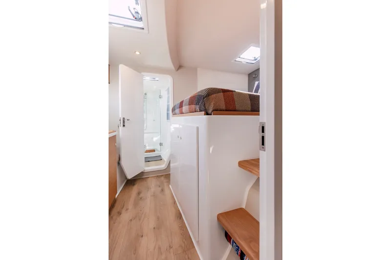 Slide: The Image of Modern interior of Vision 444ES 2024 yacht with wooden flooring and compact bathroom. - 22