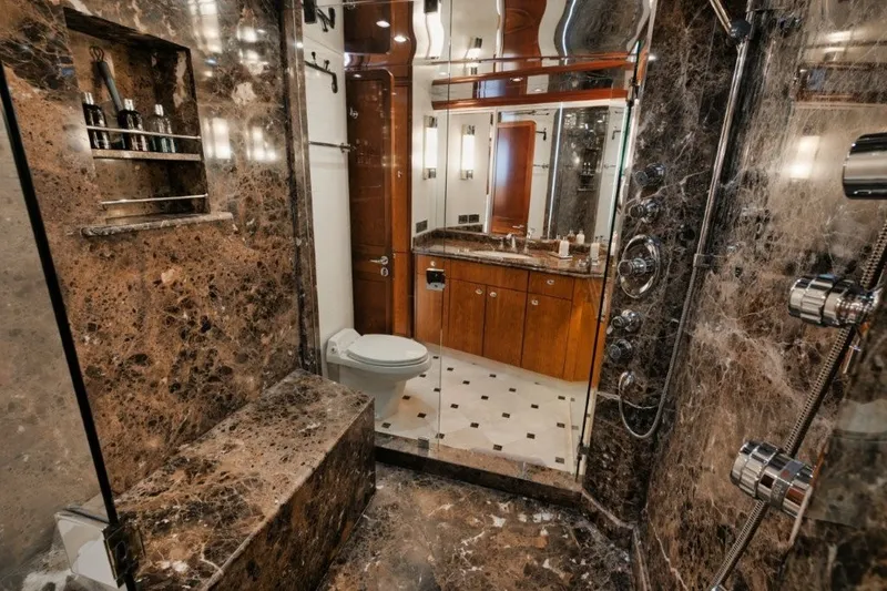Slide: The Image of Luxurious marble bathroom in 2003 Westport 112 Raised Pilothouse yacht, featuring elegant fixtures and cabinetry. - 16