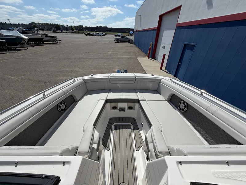 Slide: The Image of The image shows the spacious bow area of a 2025 Sea Ray SDX 290 with comfortable seating. - 49