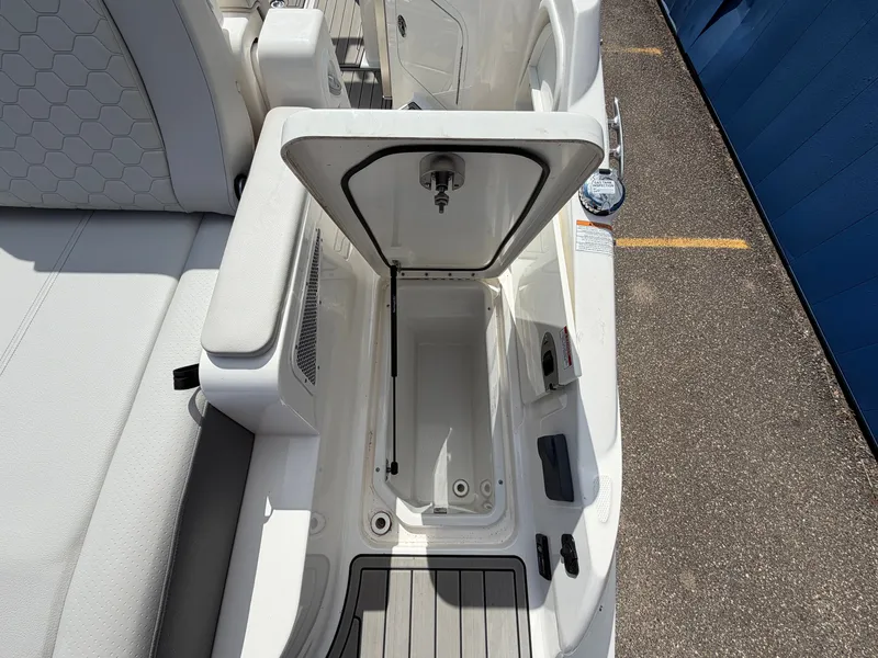 Slide: The Image of An open storage compartment on a 2025 Sea Ray SDX 290 boat. - 11