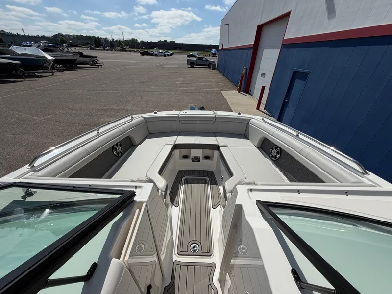 Slide: The Image of The image shows the bow of a 2025 Sea Ray SDX 290 with gray upholstery. - 47