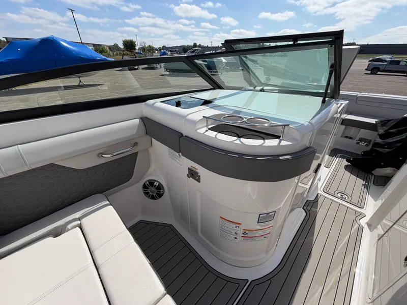 Slide: The Image of The image shows the cockpit of a 2025 Sea Ray SDX 290 with modern seating and sleek design. - 32
