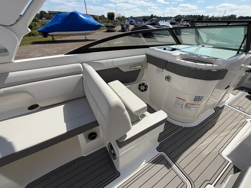 Slide: The Image of The image shows the cockpit of a 2025 Sea Ray SDX 290 with sleek seating and modern design. - 30