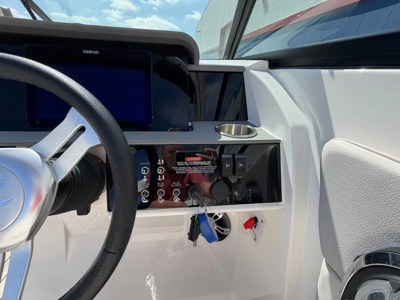 Slide: The Image of The image shows the helm of a 2025 Sea Ray SDX 290 with modern controls. - 40