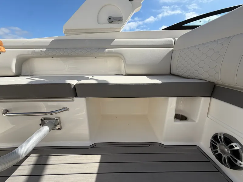 Slide: The Image of The image shows the cockpit of a 2025 Sea Ray SDX 290 boat with sleek seating. - 26