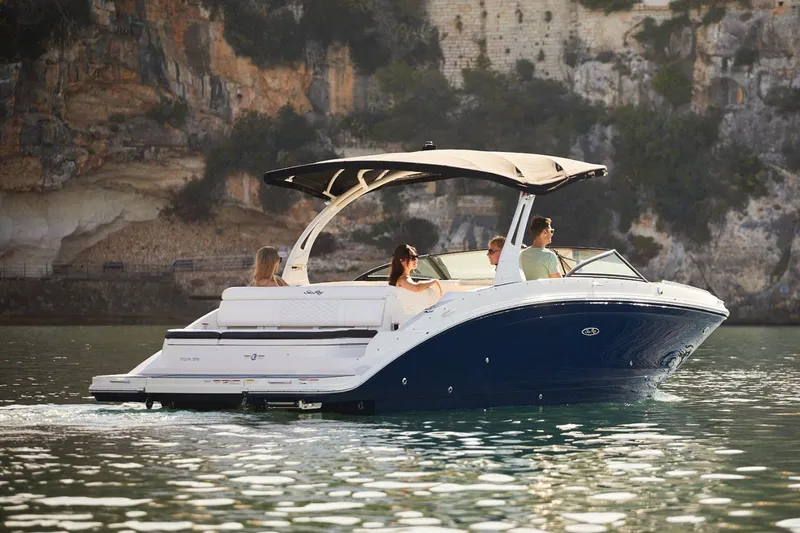 The Image of Manufacturer Provided Image: 2021 Sea Ray SDX 270 boat cruising on scenic water with passengers. - 0