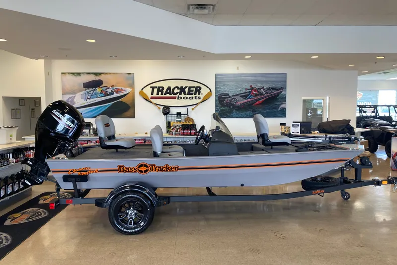 The Image of 2027 Tracker Bass Tracker Classic Limited boat displayed in showroom with Mercury engine. - 0