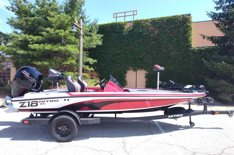 The Image of 2027 Nitro Z18 XL Pro boat on trailer, parked outdoors, side view. - 0