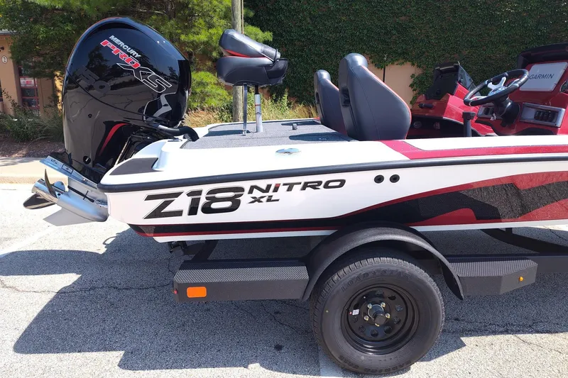 Slide: The Image of 2027 Nitro Z18 XL Pro boat with Mercury Pro XS engine, parked outdoors. - 3