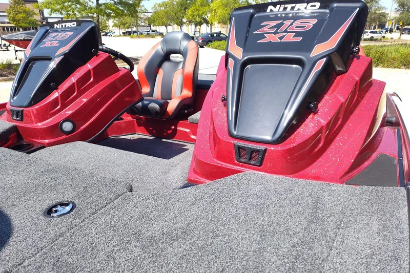 Slide: The Image of 2027 Nitro Z18 XL Pro boat interior with red accents and seating. - 12