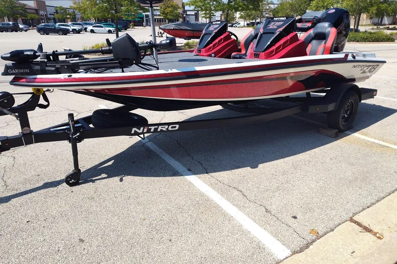 Slide: The Image of 2027 Nitro Z18 XL Pro fishing boat on trailer in parking lot. - 14