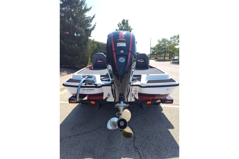 Slide: The Image of 2027 Nitro Z18 XL Pro boat with powerful outboard motor, parked outdoors. - 15