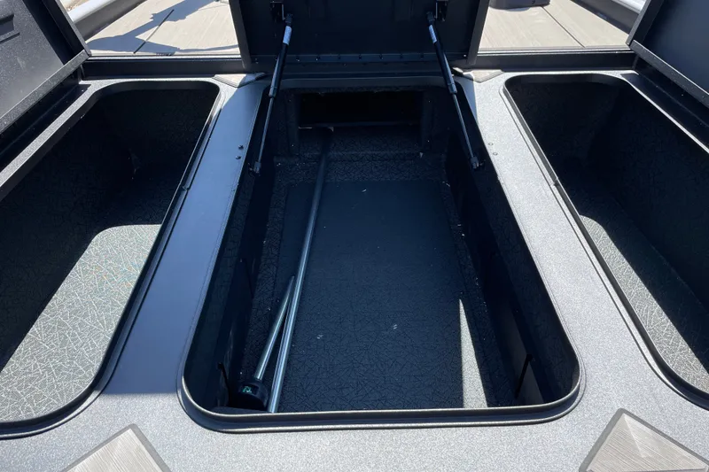 Slide: The Image of Open storage compartment in 2027 Tracker Pro 170 boat, showcasing spacious interior design. - 14