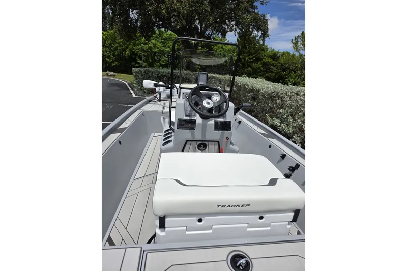 Slide: The Image of 2027 Tracker Bass Tracker Classic CC boat interior with steering wheel and seating. - 55