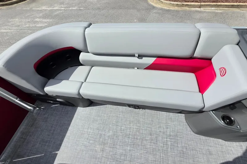 Slide: The Image of 2027 Sun Tracker Party Barge 20 DLX pontoon boat seating with gray and red upholstery. - 17