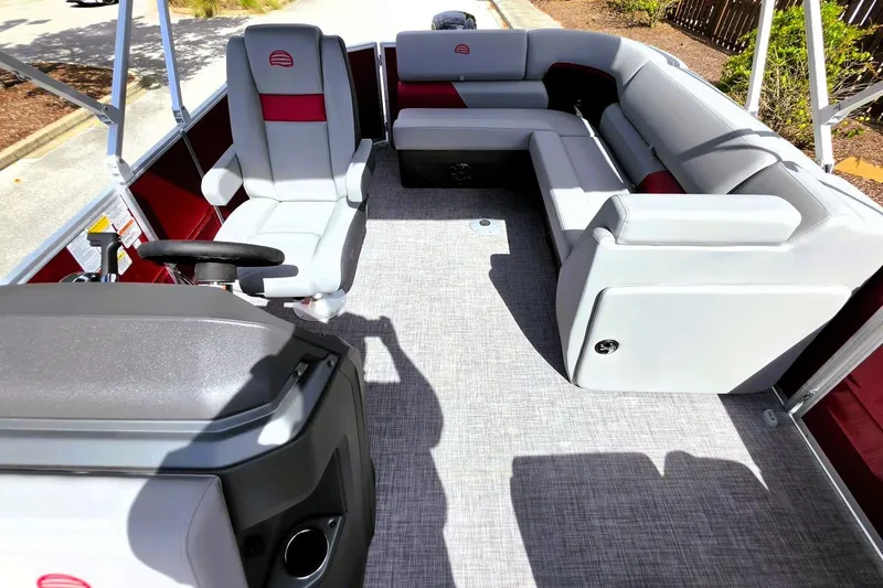 Slide: The Image of Interior of 2027 Sun Tracker Party Barge 20 DLX with spacious seating and helm. - 19