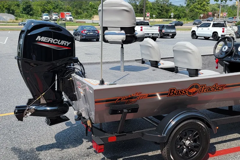 The Image of 2027 Tracker Bass Tracker Classic Limited boat with Mercury engine in parking lot. - 0