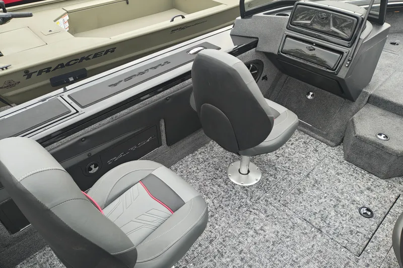 Slide: The Image of Interior of 2026 Tracker Targa V-19 WT boat with gray seating and dashboard. - 22