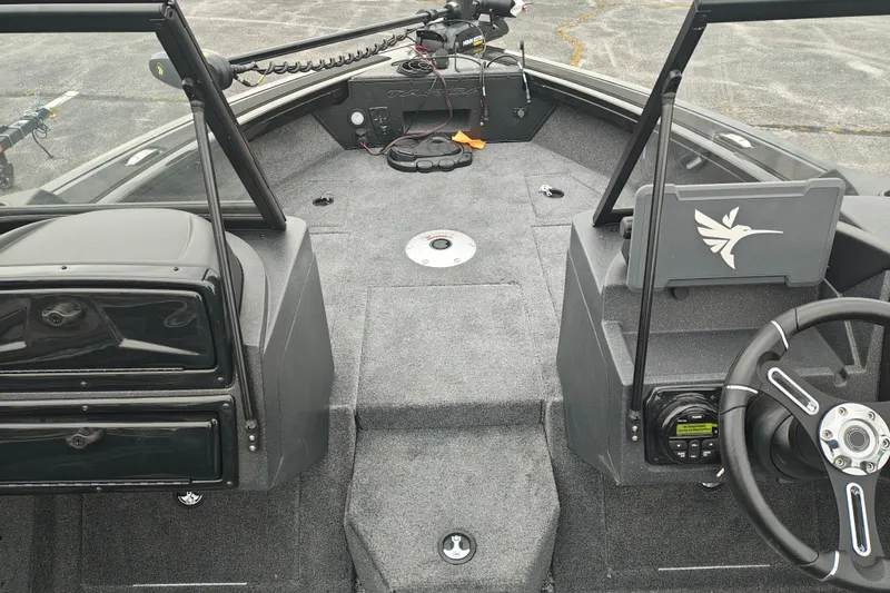 Slide: The Image of 2026 Tracker Targa V-19 WT boat interior with steering wheel and control panel. - 27