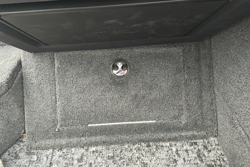 Slide: The Image of Carpeted storage compartment in 2026 Tracker Targa V-19 WT boat interior. - 20