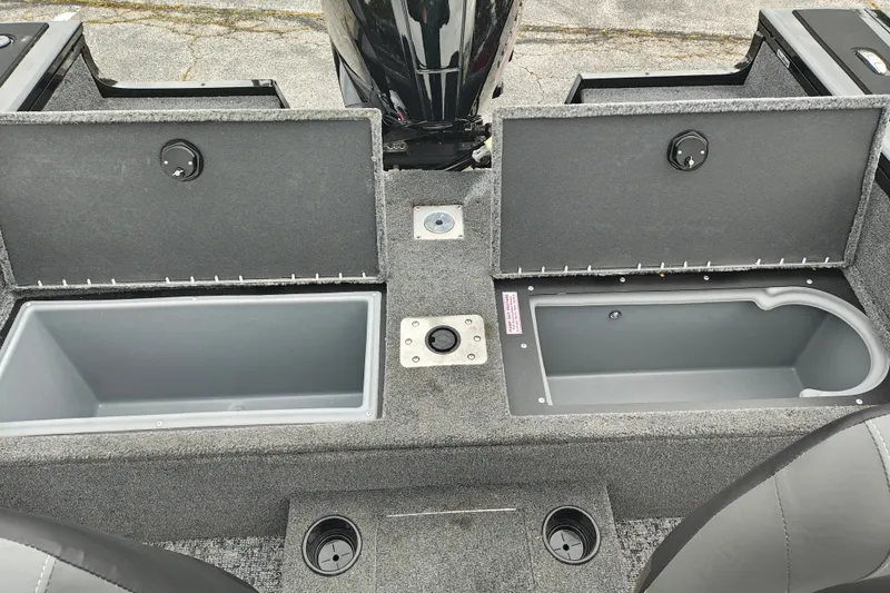 Slide: The Image of 2026 Tracker Targa V-19 WT boat storage compartments with open lids, showcasing interior space. - 41
