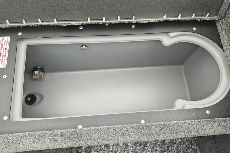 Slide: The Image of Storage compartment in 2026 Tracker Targa V-19 WT boat, featuring a gray interior. - 42