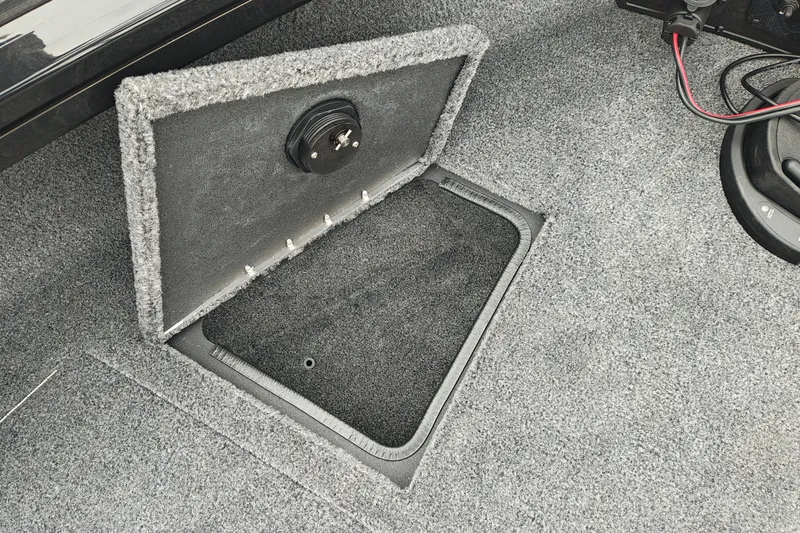 Slide: The Image of Open storage compartment in 2026 Tracker Targa V-19 WT boat interior. - 32
