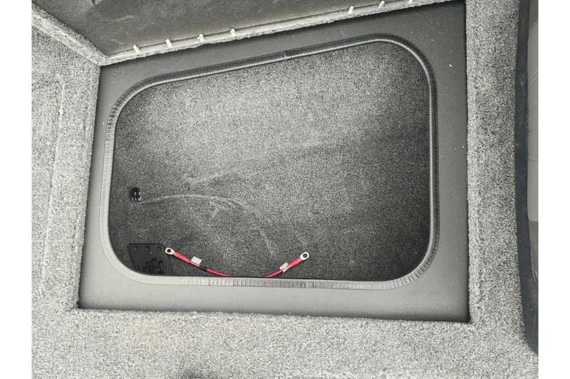 Slide: The Image of 2026 Tracker Targa V-19 WT boat storage compartment with wiring details. - 34
