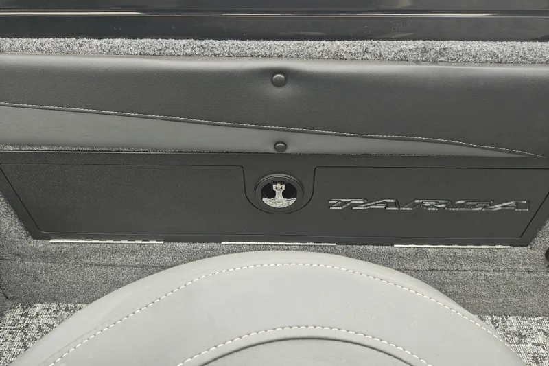 Slide: The Image of 2026 Tracker Targa V-19 WT interior detail with sleek black panel and logo. - 24