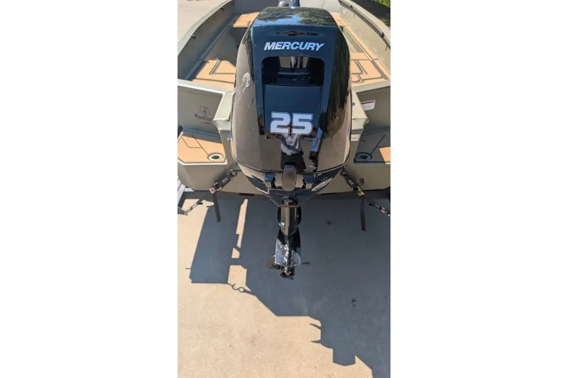 Slide: The Image of 2027 Tracker Grizzly 1553 Timber boat with Mercury 25 horsepower outboard motor. - 18