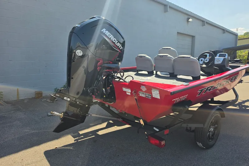 The Image of 2027 Tracker Pro Team 175 Crappie Edition boat with Mercury engine, parked outdoors. - 0