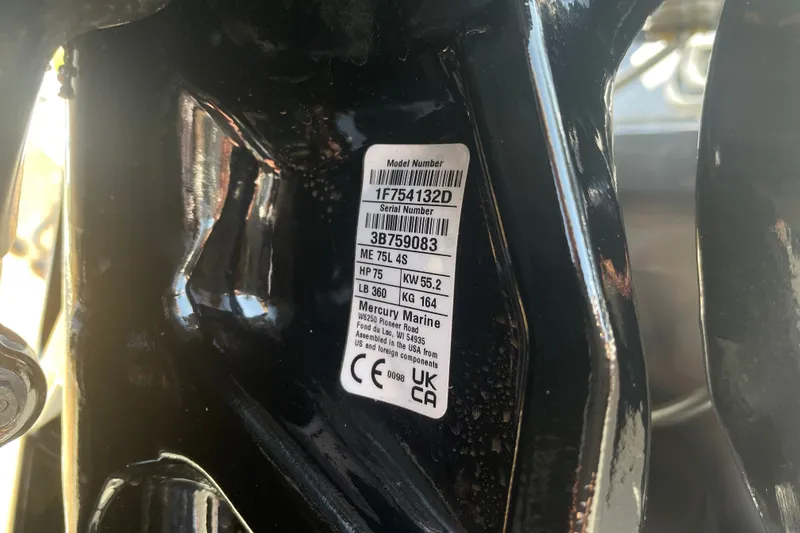 Slide: The Image of Label on 2027 Tracker Pro Team 175 boat engine, showing model and serial numbers. - 55
