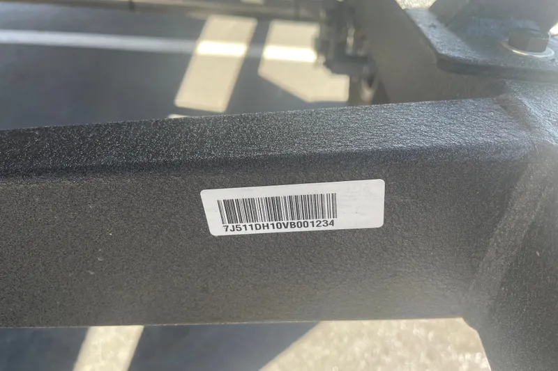 Slide: The Image of Barcode label on 2027 Tracker Pro Team 175 boat trailer frame. - 56