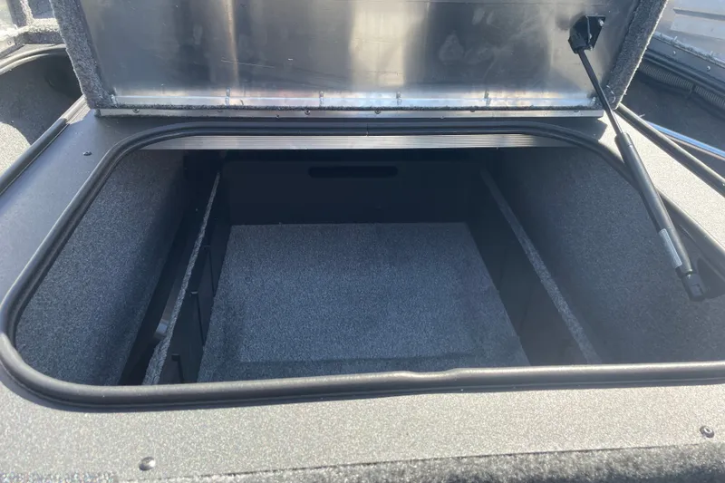 Slide: The Image of Open storage compartment in 2027 Tracker Pro Team 175 boat. - 16
