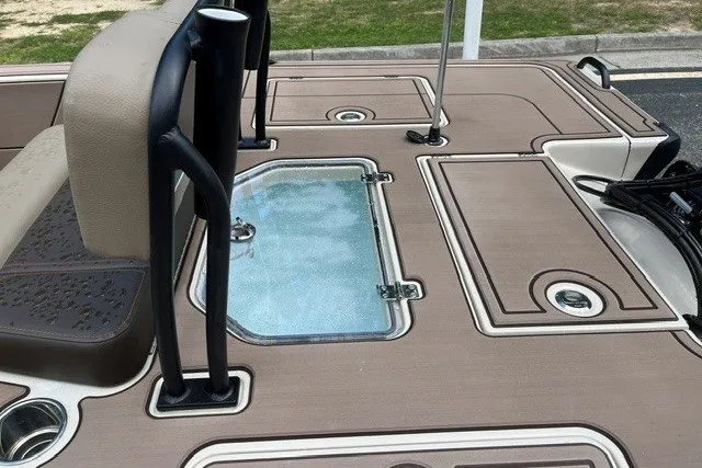 Slide: The Image of 2026 Mako 18 Pro Skiff Backwater Edition deck with storage compartments and seating. - 14