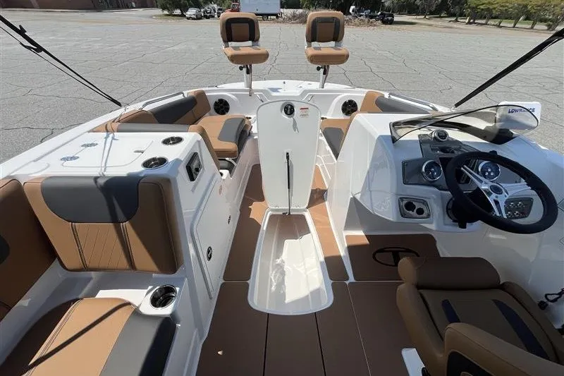 Slide: The Image of Interior of a 2026 Tahoe 1950 boat with seating and steering console. - 10