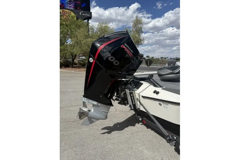 Slide: The Image of Outboard motor on a 2026 Ranger ALPHA 208 boat under a cloudy sky. - 9