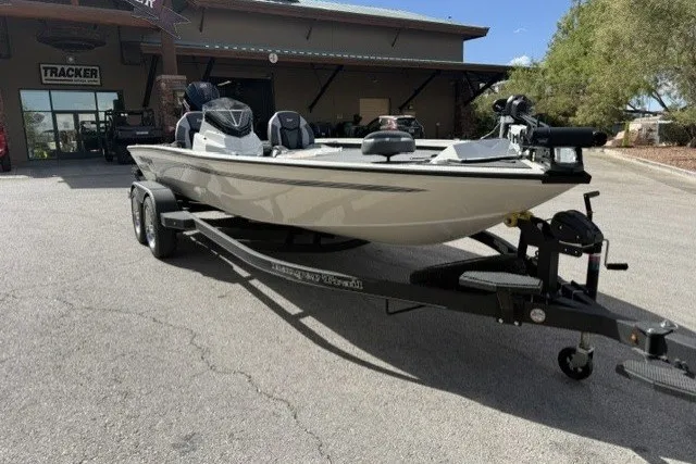 The Image of 2026 Ranger ALPHA 208 boat on trailer outside dealership. - 0