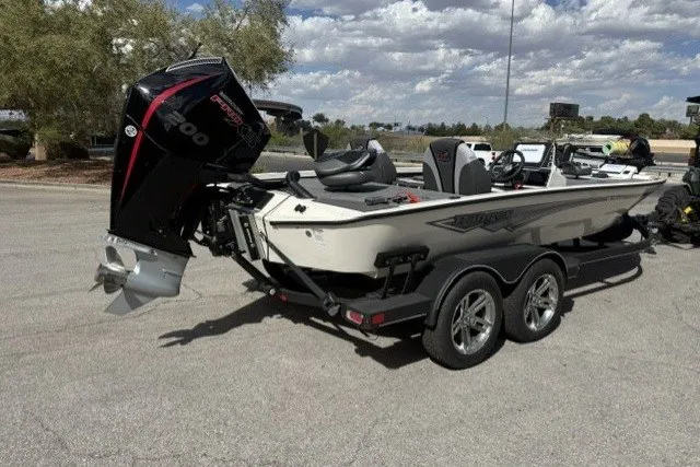 Slide: The Image of 2026 Ranger ALPHA 208 boat with powerful outboard motor on a trailer. - 2