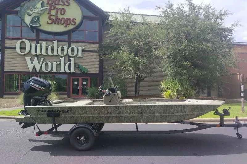 The Image of 2027 Tracker Grizzly 1860 CC boat on trailer outside Bass Pro Shops. - 0