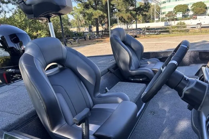 Slide: The Image of 2027 Nitro Z18 XL Pro boat interior with sleek seating and steering wheel. - 16