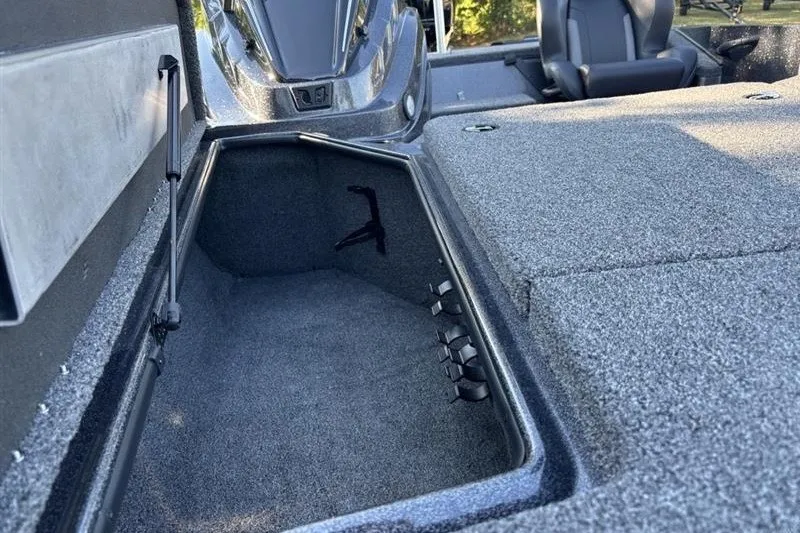 Slide: The Image of Interior storage compartment of 2027 Nitro Z18 XL Pro boat, featuring carpeted finish. - 19