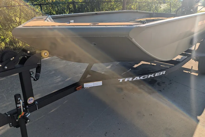 The Image of 2027 Tracker Grizzly 1553 Timber boat on trailer in sunlight. - 0