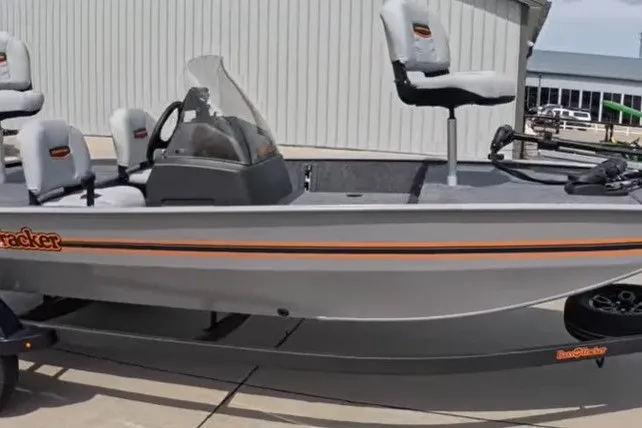 The Image of 2027 Tracker Bass Tracker Classic Limited boat, gray with orange accents, parked on trailer. - 0