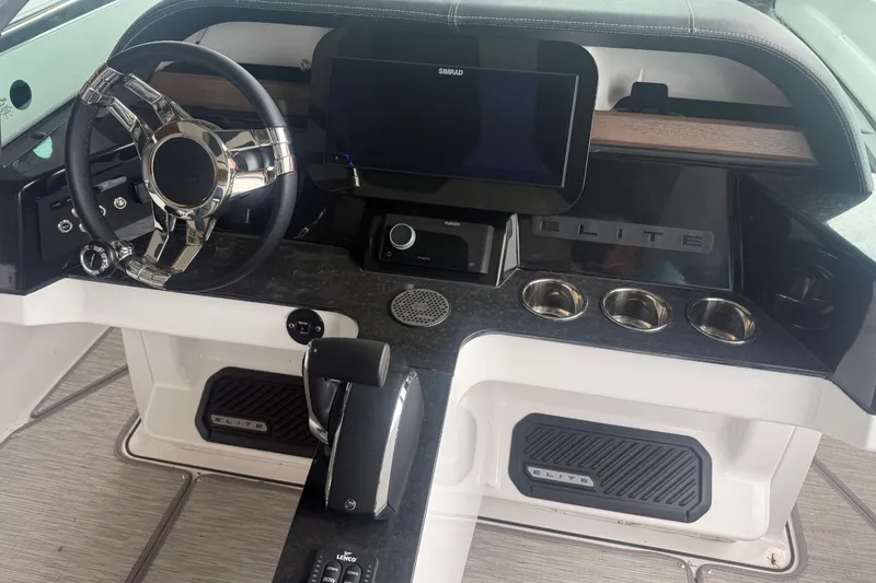 Slide: The Image of 2025 Monterey Elite 27 OB dashboard with steering wheel, touchscreen, and controls. - 9