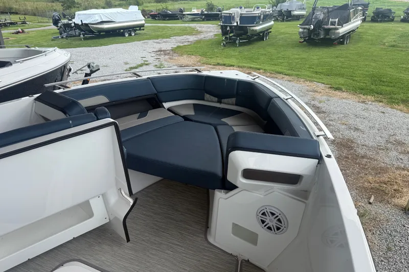 Slide: The Image of 2025 Monterey Elite 27 OB boat interior with spacious seating and modern design. - 10